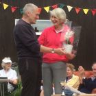 David Body presenting Vine Spragg with an orchid